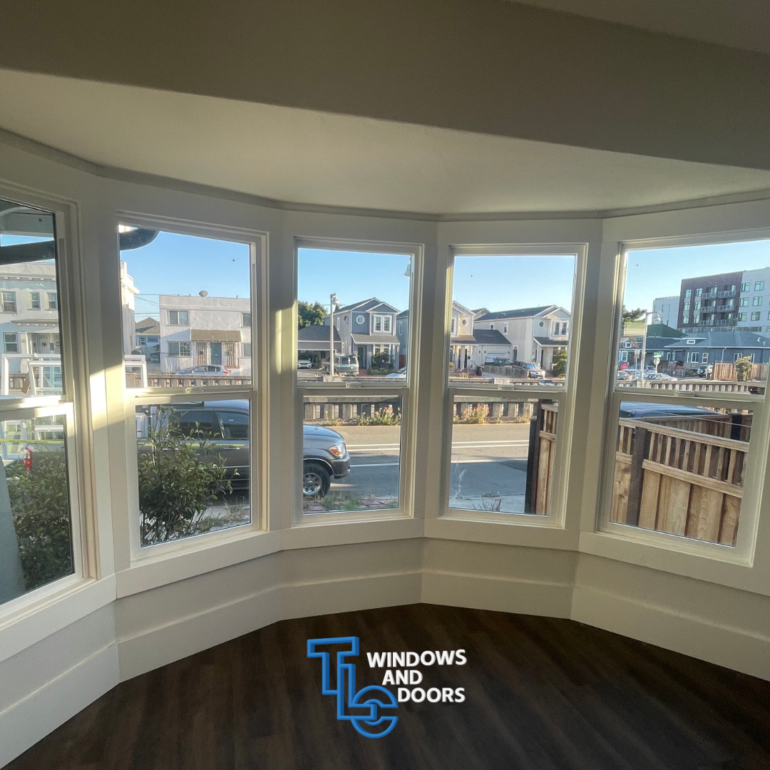 TLC Windows bay window installation showcasing panoramic neighborhood views with professional craftsmanship